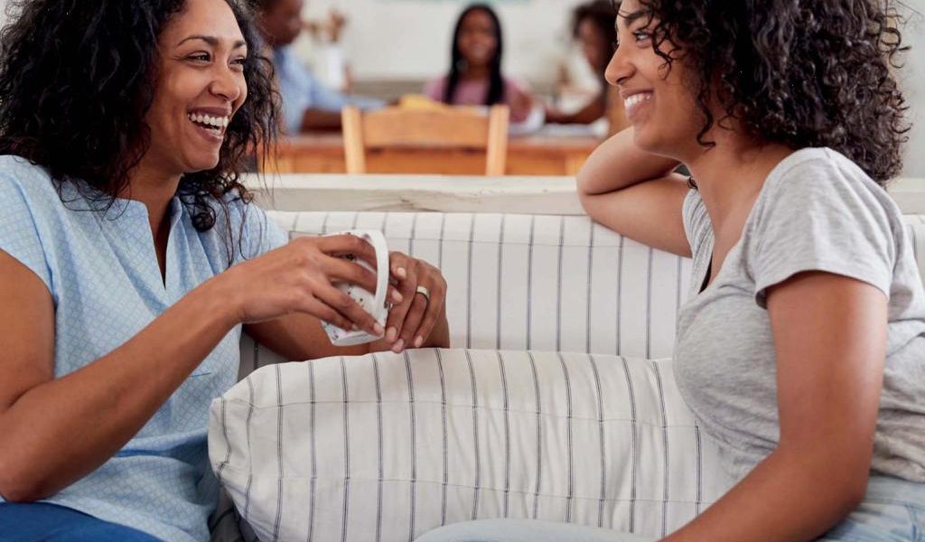 A mother and daughter chatting