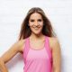 Amanda Byram posing in sports gear