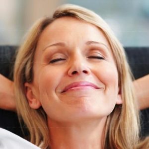 Women leaning back, eyes closed and smiling