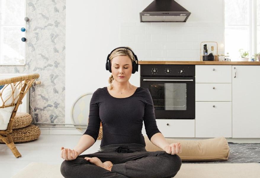 woman meditating at home stress relief