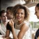 Woman laughing with friends at bar
