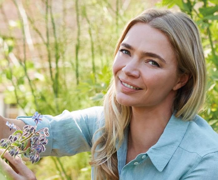 Jodie Kidd picking wild flowers