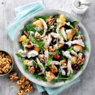 A chicken and walnut salad in a bowl