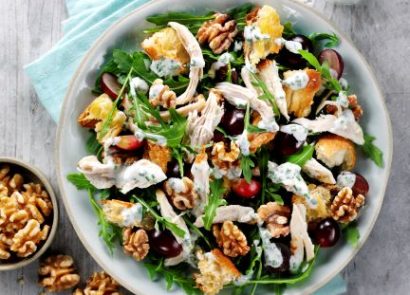 A chicken and walnut salad in a bowl