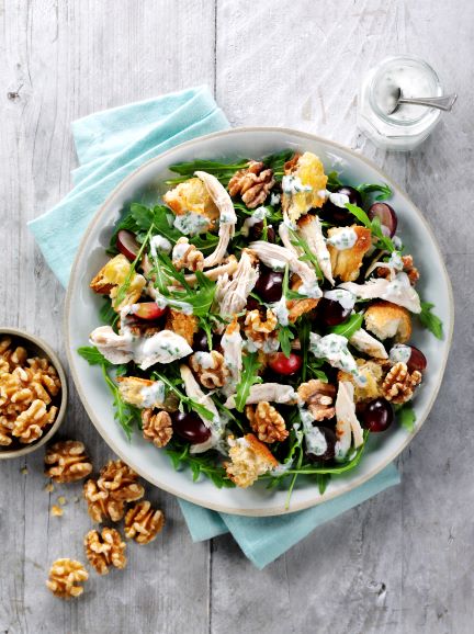 A chicken and walnut salad in a bowl