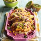 Zespri chicken and kiwi tacos laid out on a pink tray