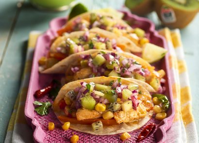 Zespri chicken and kiwi tacos laid out on a pink tray