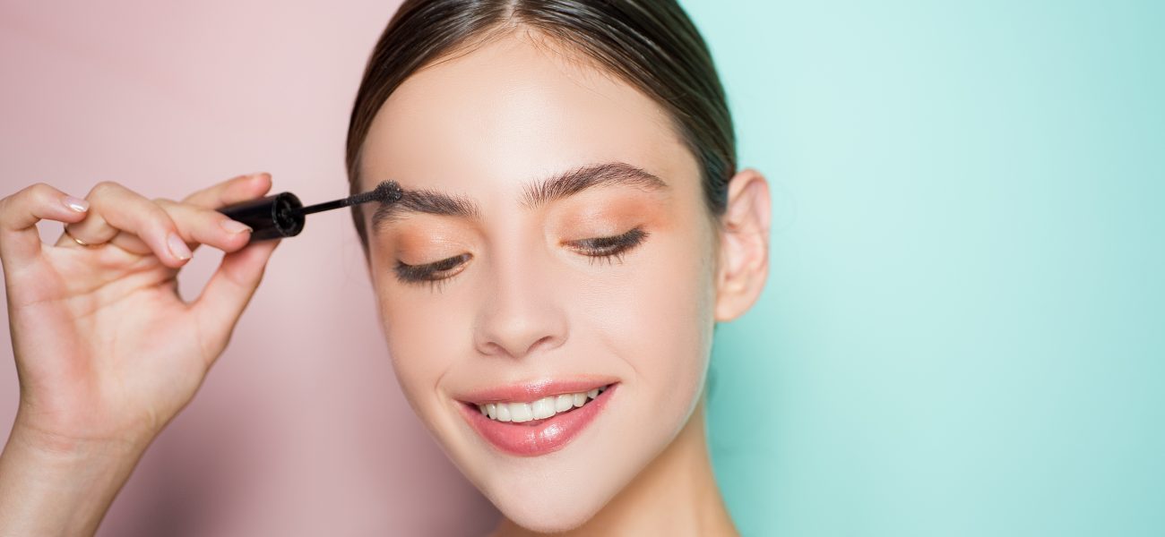 Woman-applying-eyebrow-gel