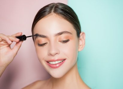 Woman-applying-eyebrow-gel