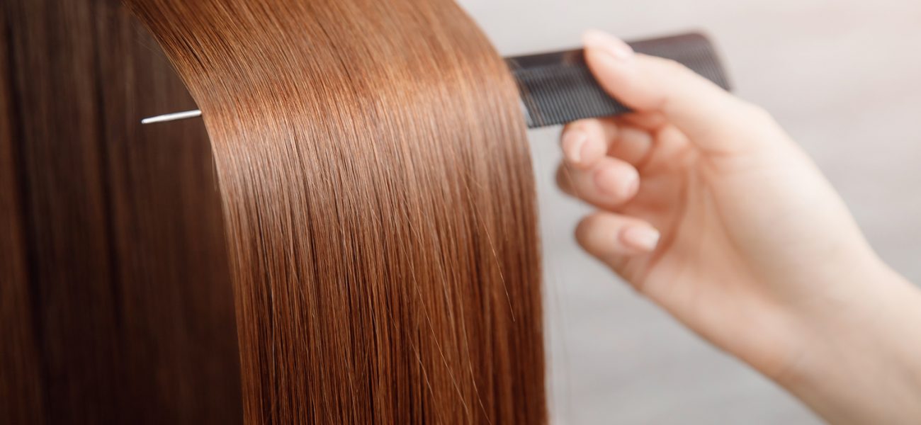 Shiny hair being brushed