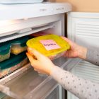 Woman labels her fruits and vegetables ready to be frozen during the coronavirus pandemic