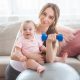 Mother with a baby, doing postnatal workout