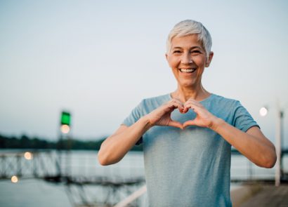 Senior woman looks after her breasts by checking them regularly