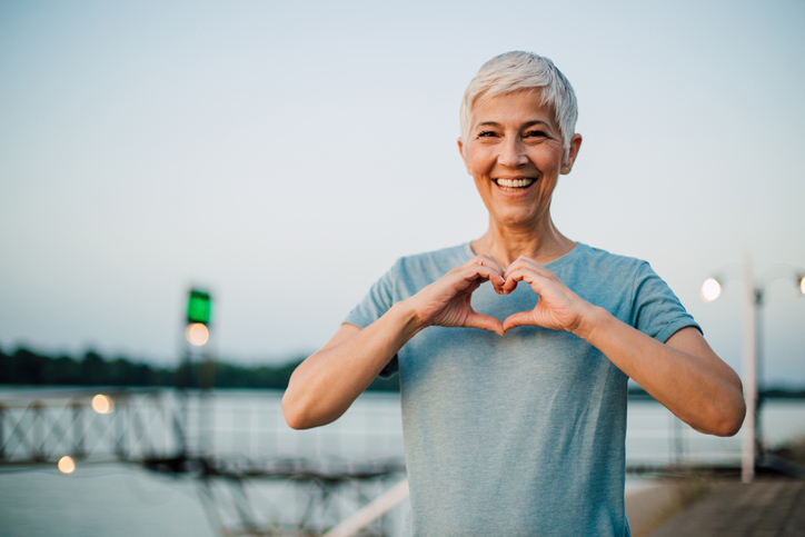 Senior woman looks after her breasts by checking them regularly