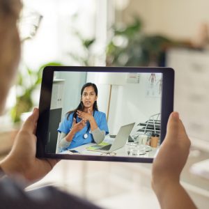 woman having virtual doctors appointment