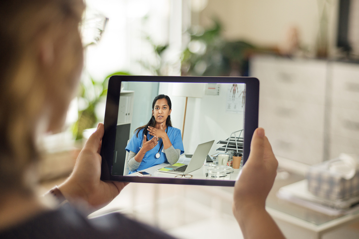 woman having virtual doctors appointment