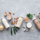 dairy-free milk bottles on grey background