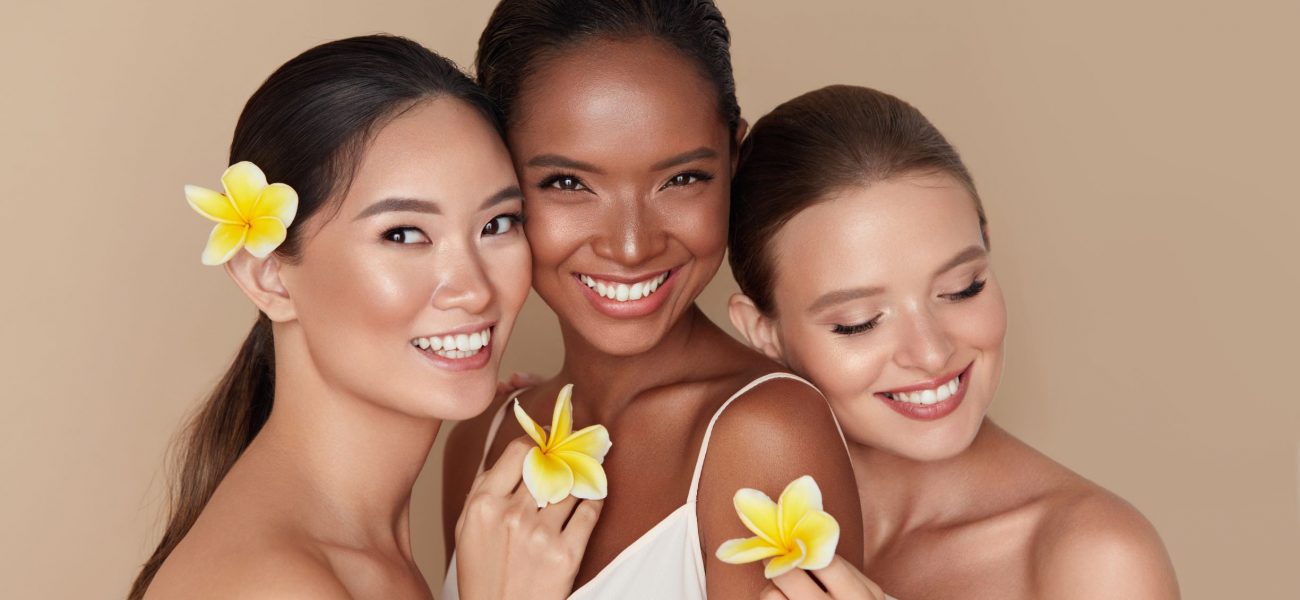 Smiling diverse women with healthy glowing skin