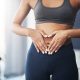 woman with hands on stomach