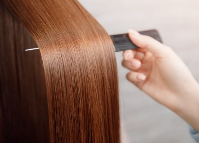 Shiny hair being brushed