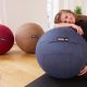 fit woman leaning on stability ball