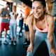 Woman in gym, happy and confident