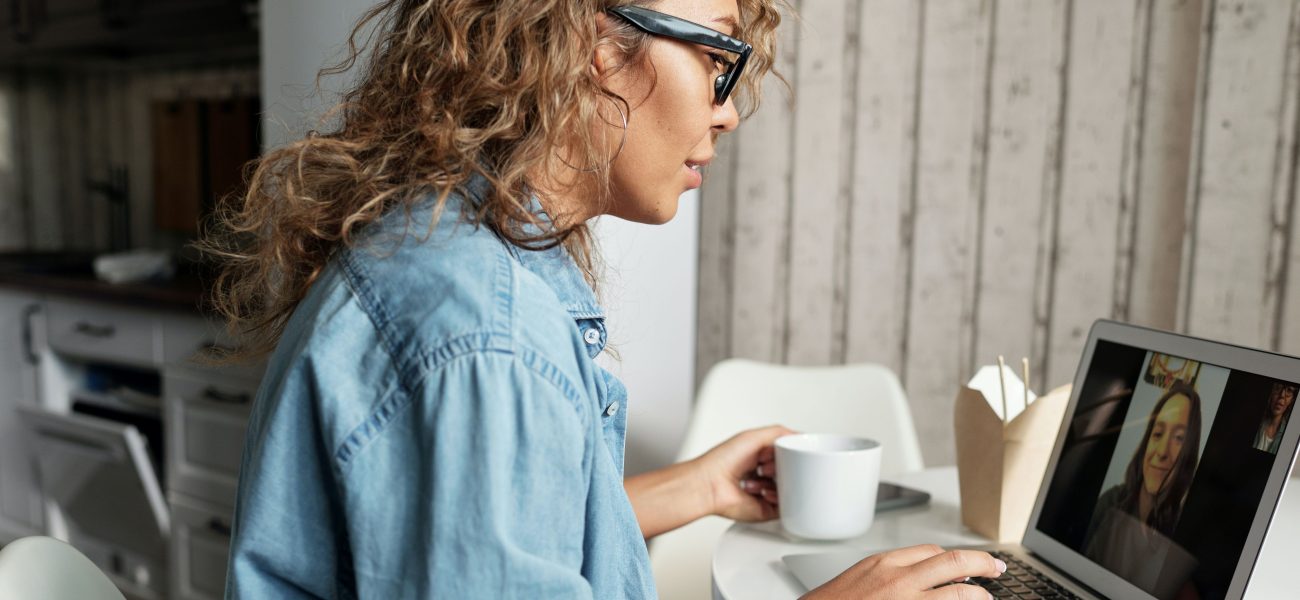 Woman talking during online therapy