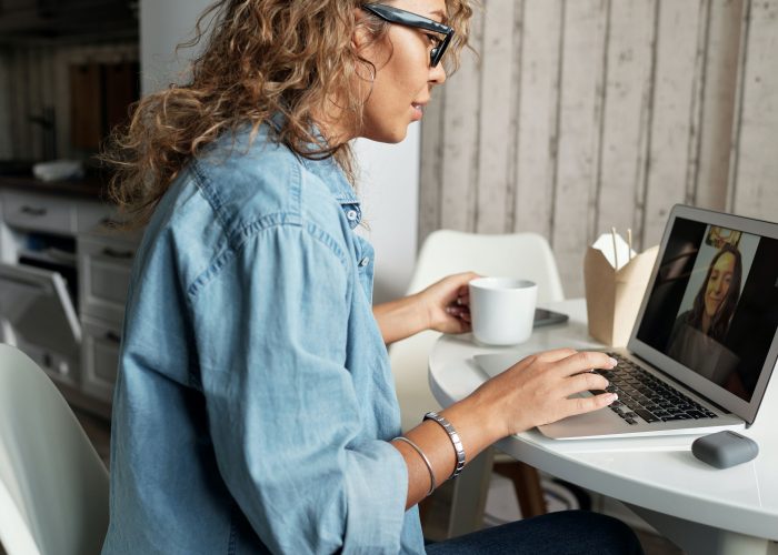 Woman talking during online therapy