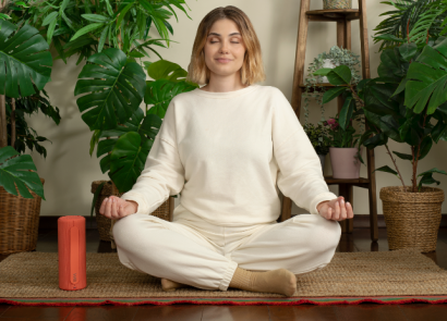 Woman listening to bluetooth speaker