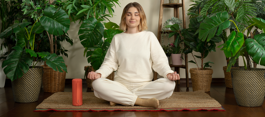 Woman listening to bluetooth speaker