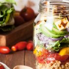 A glass jar filled with healthy foods