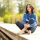 A woman sitting on a jetty
