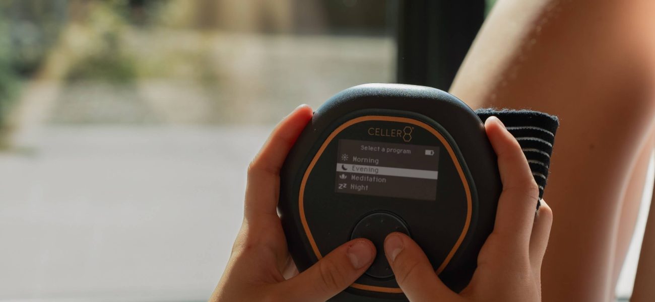 A CELLER8 PEMF device held in two hands