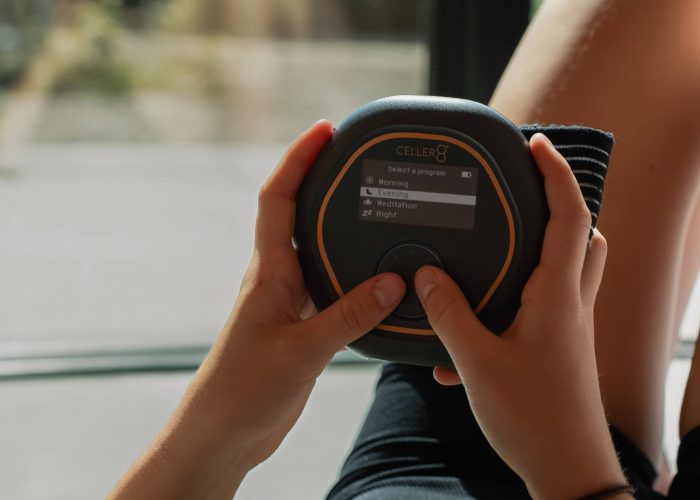 A CELLER8 PEMF device held in two hands