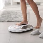 A woman stepping onto a set of scales