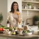 A woman standing in a kitchen holding a glass