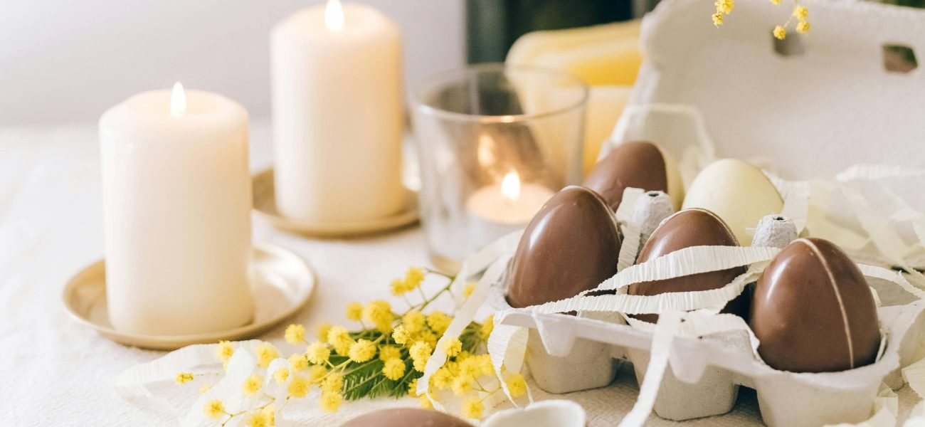 Easter eggs and candles on a table
