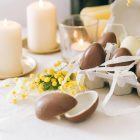 Easter eggs and candles on a table
