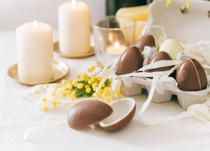 Easter eggs and candles on a table
