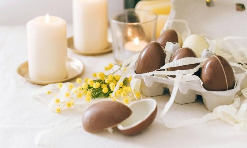 Easter eggs and candles on a table