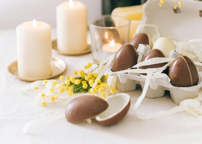 Easter eggs and candles on a table
