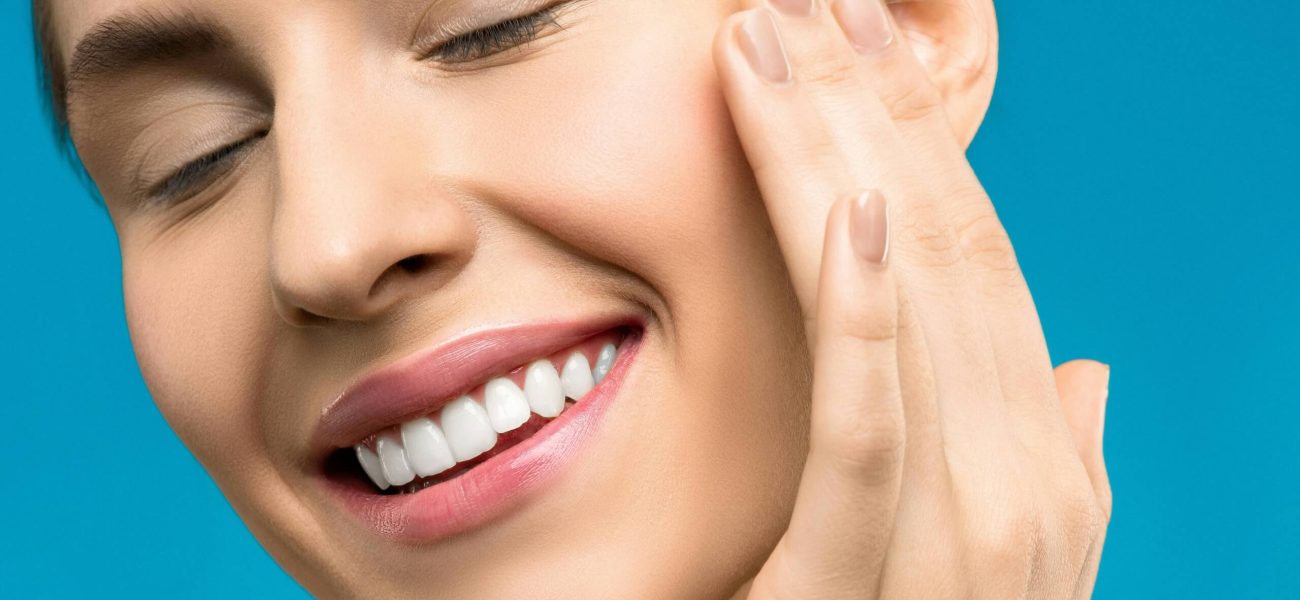 A close up shot of a woman smiling