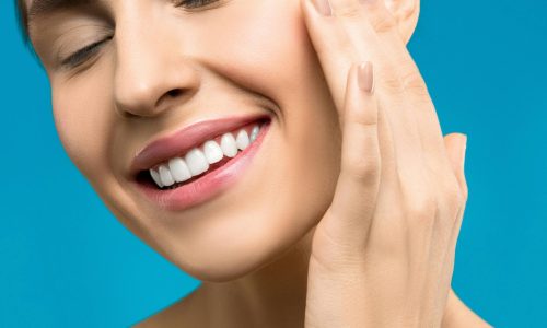 A close up shot of a woman smiling