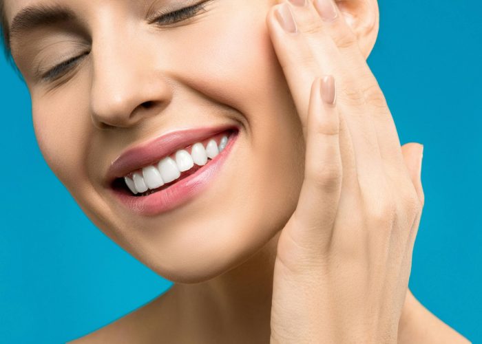 A close up shot of a woman smiling