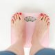 A woman's feet standing on a set of scales