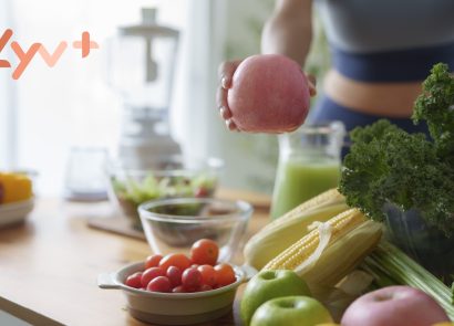 A woman preparing healthy food in a kitchen