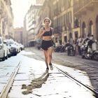 A woman running down a city street