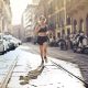 A woman running down a city street