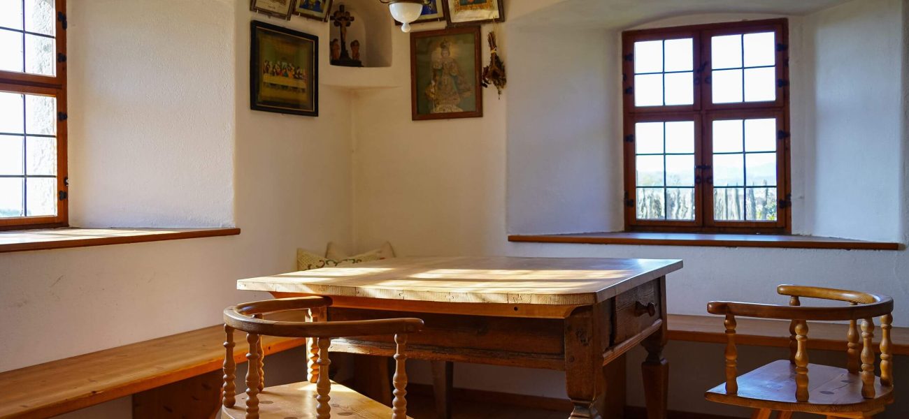 A rustic farmhouse dining room with table and chairs