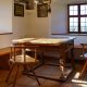 A rustic farmhouse dining room with table and chairs
